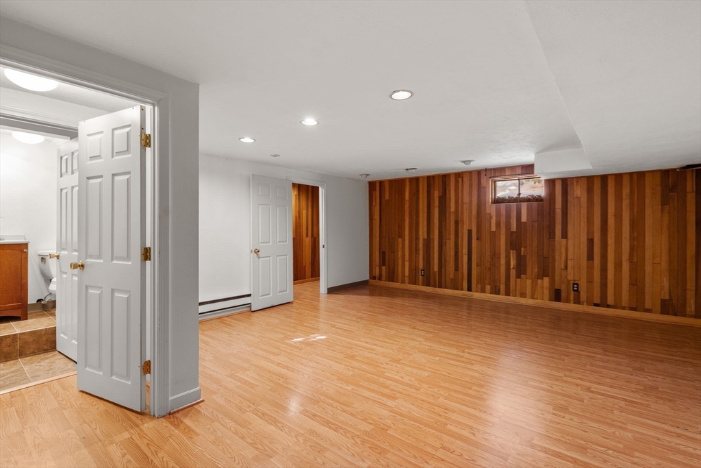 9 April Lane, Unit 9 Lexington, MA 02421 - Photo 35 of 38 a view of an empty room with wooden floor