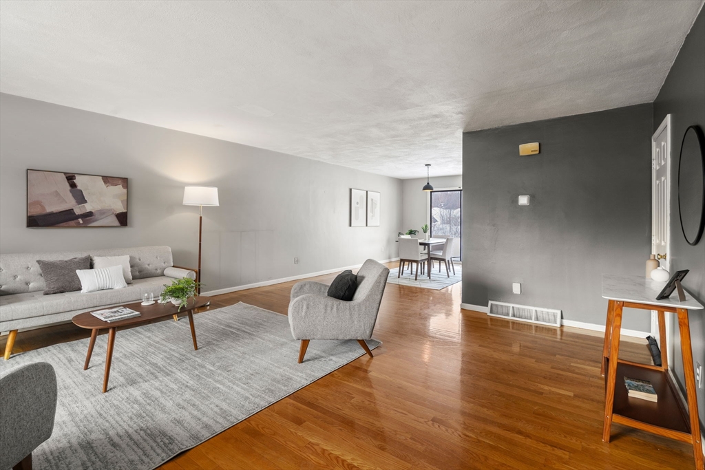 9 April Lane, Unit 9 Lexington, MA 02421 - Photo 5 of 38 a living room with furniture and wooden floor