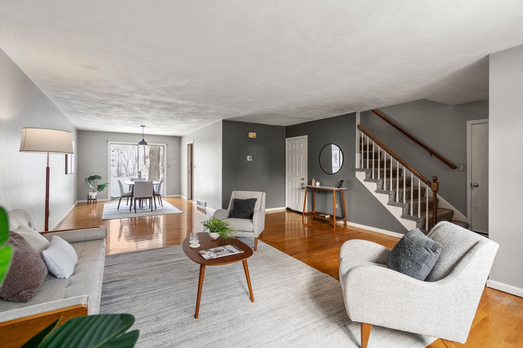9 April Lane, Unit 9 Lexington, MA 02421 - Photo 7 of 38 a living room with furniture and a wooden floor