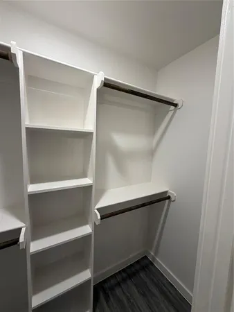a view of an empty walk in closet