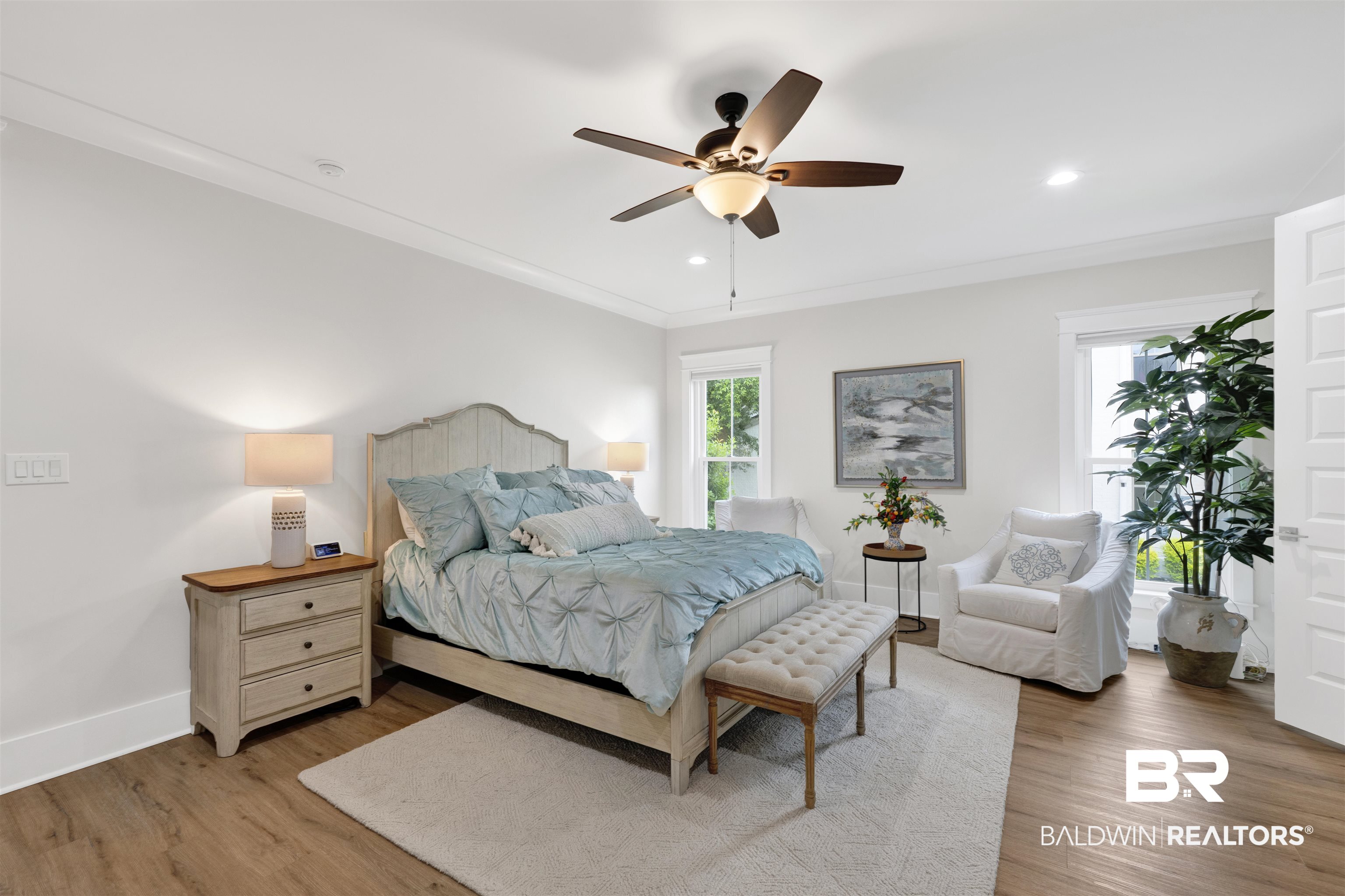 21702 Pillars Street Fairhope, AL 36532 - Photo 19 of 54 Spacious room featuring wood-finish flooring, white trim, and a ceiling fan with integrated lighting