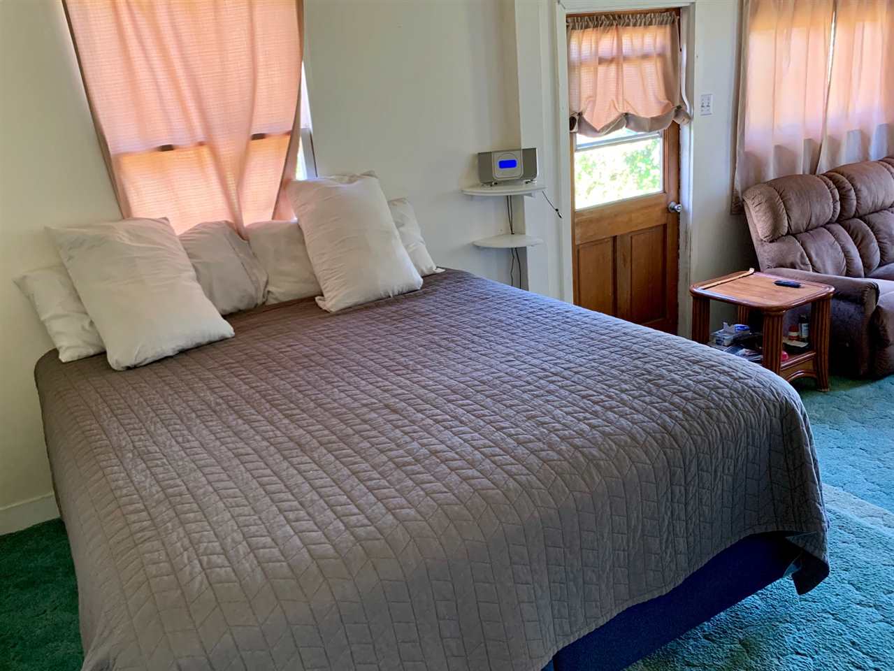 397 Middle Road Kula, HI 96790 - Photo 5 of 10 a bedroom with a bed and window