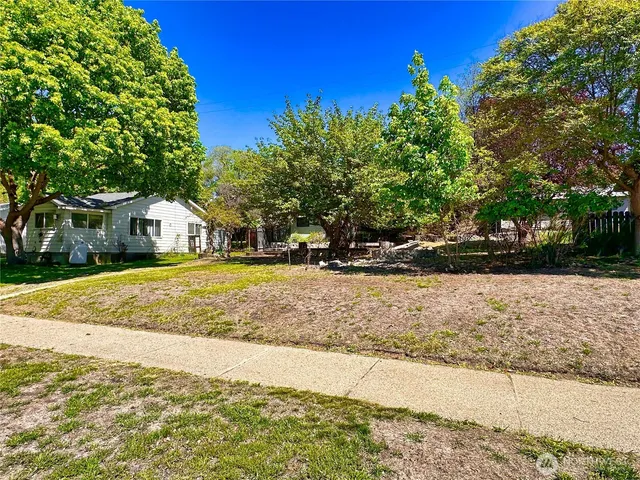 a view of a house with snow on the road