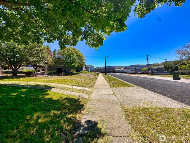 a view of swimming pool with outdoor seating and yard