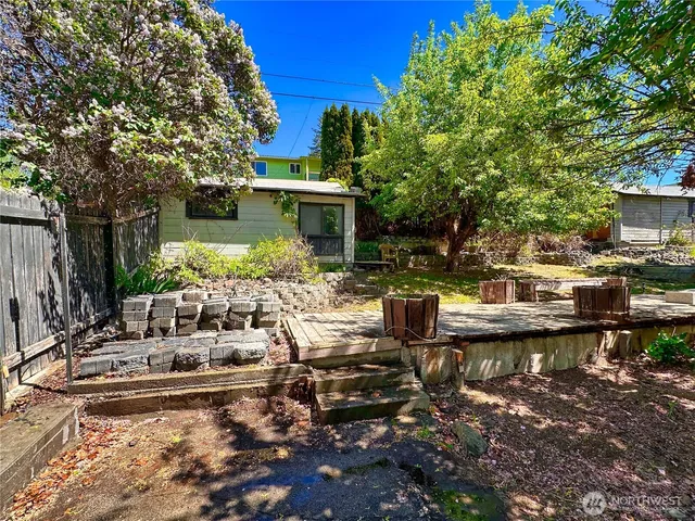 a view of a house with swimming pool and sitting area
