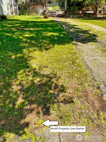 a view of yard with swimming pool and green space