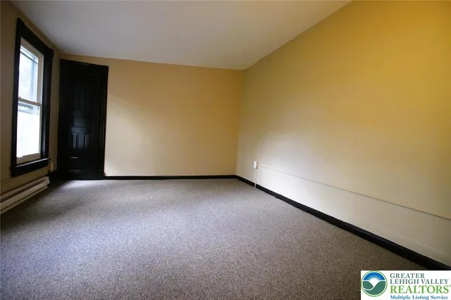 a view of an empty room and window