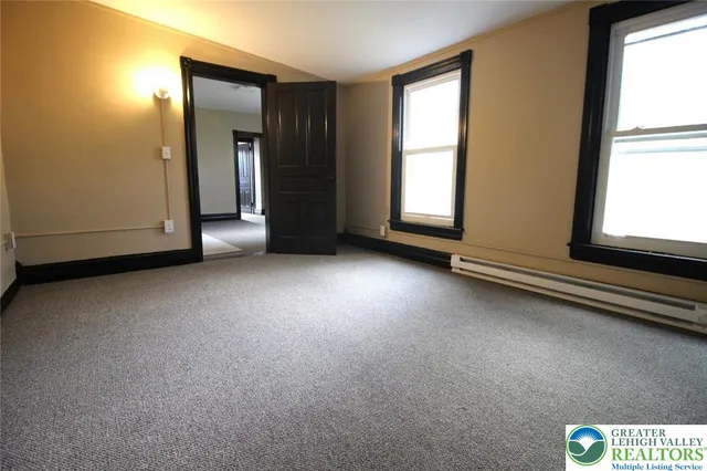 an empty room with windows