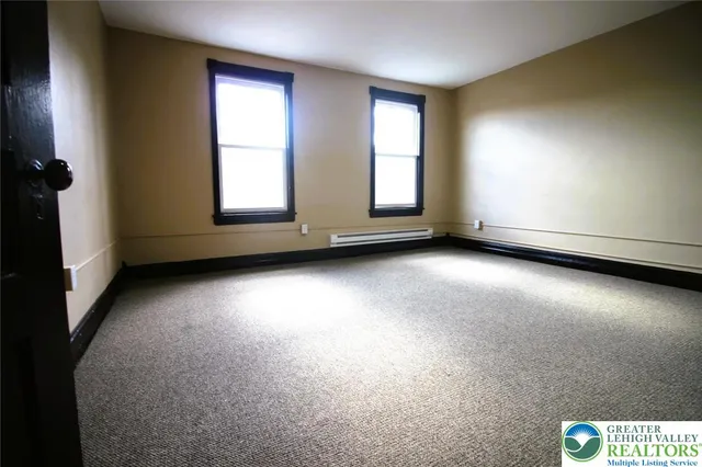 an empty room with windows
