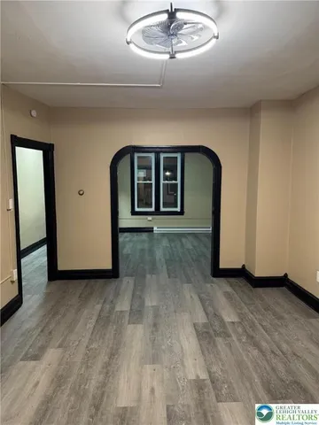 a view of a livingroom with wooden floor