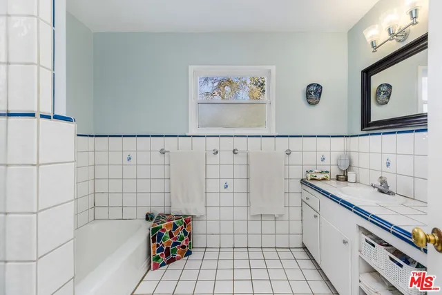 a bathroom with a sink and a shower