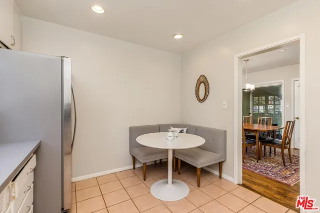 a view of a room with chairs and a table in a room