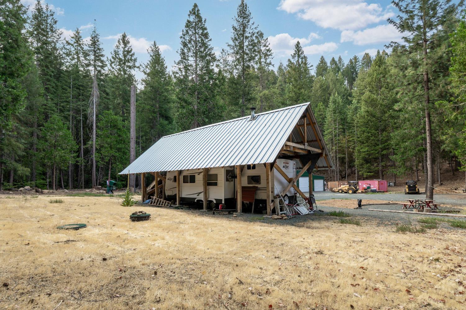 10623 Yearling Road Nevada City, CA 95959 - Photo 2 of 59 a view of a house with a yard and sitting area