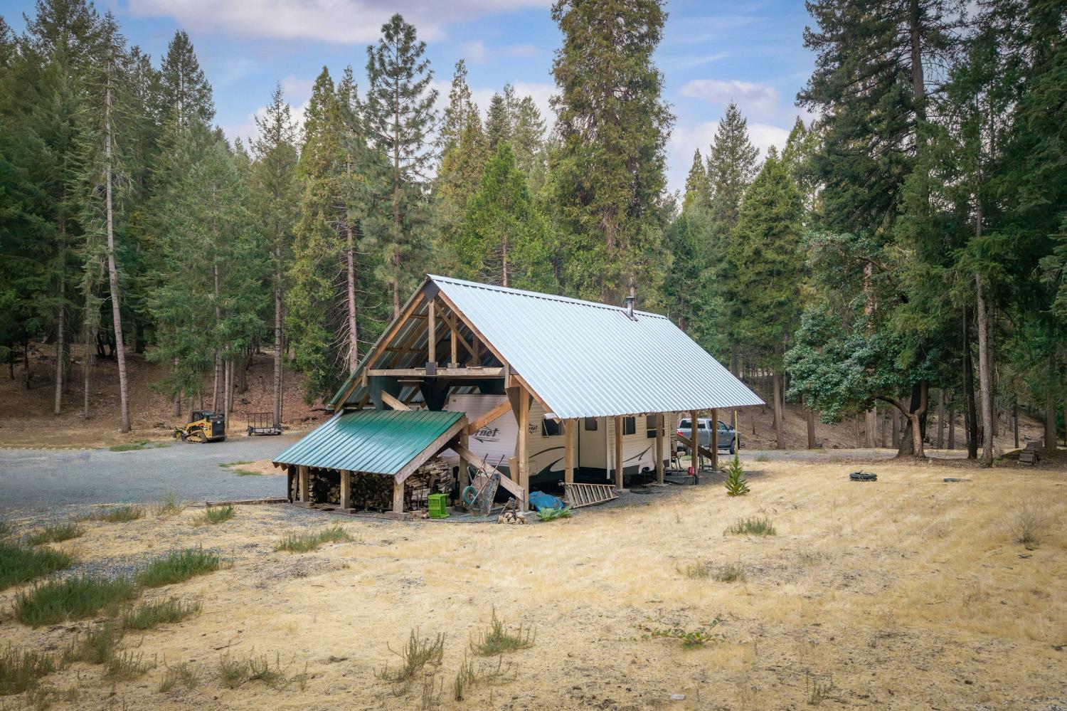 10623 Yearling Road Nevada City, CA 95959 - Photo 22 of 59 a view of a house with a yard and sitting area