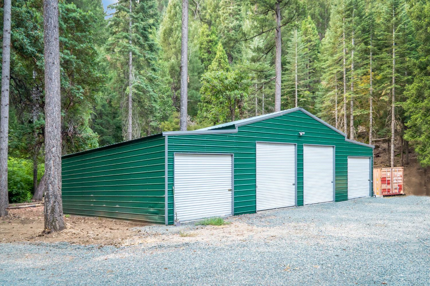 10623 Yearling Road Nevada City, CA 95959 - Photo 3 of 59 a view of a house with a yard and garage