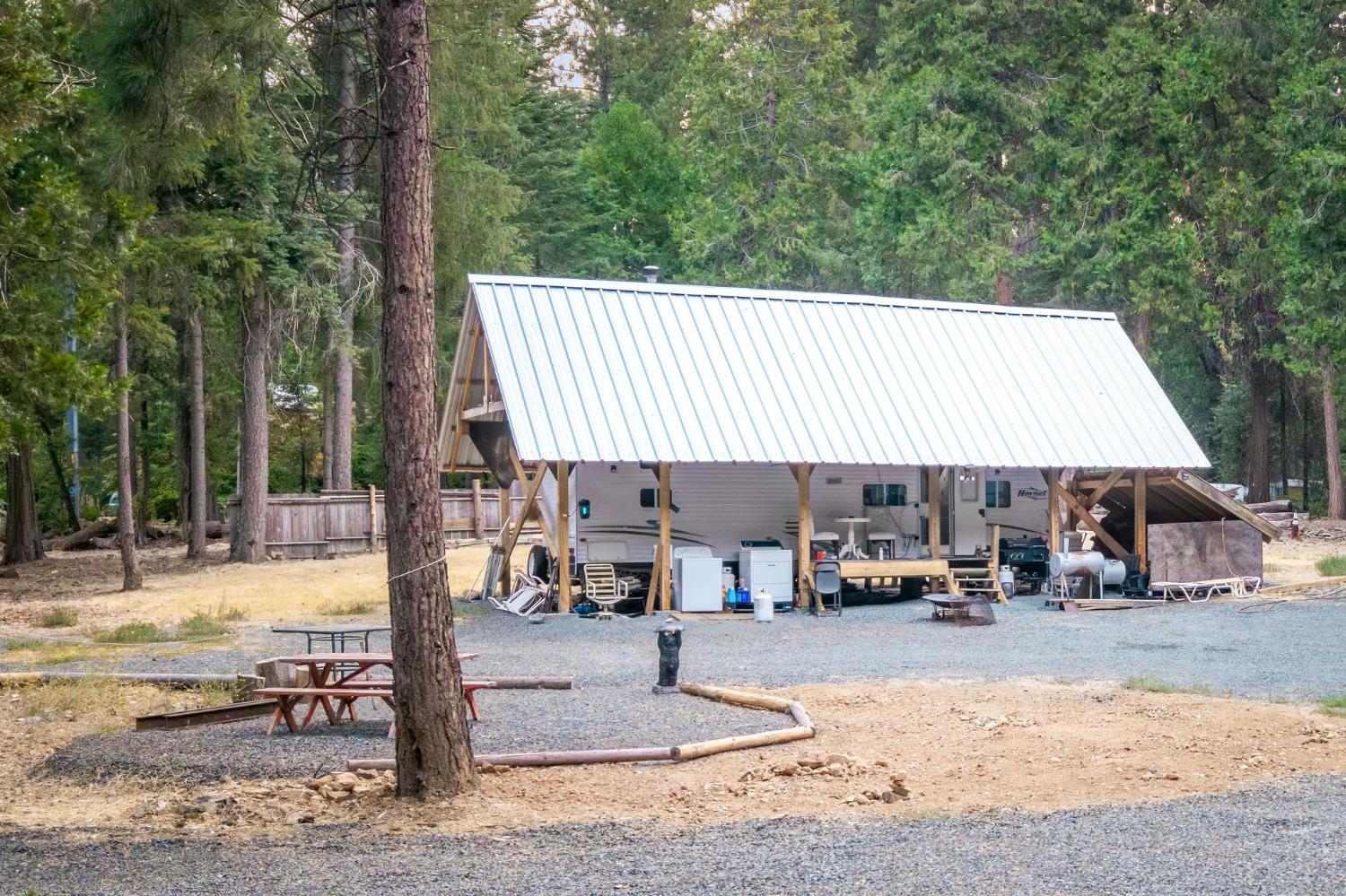 10623 Yearling Road Nevada City, CA 95959 - Photo 7 of 59 a view of a patio with a table and chairs