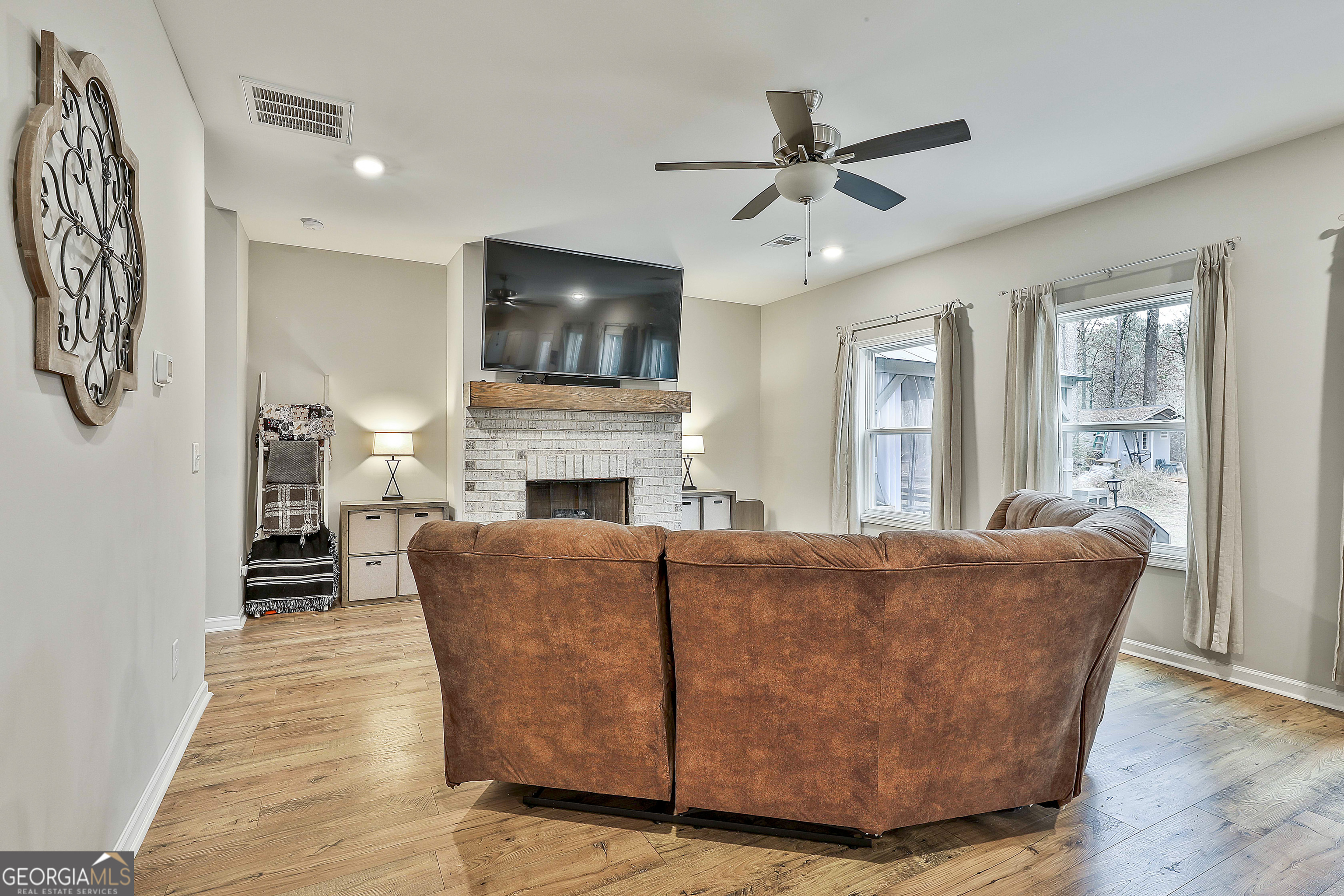 250 Mobley Bridge Road LaGrange, GA 30241 - Photo 13 of 42 a living room with furniture and a flat screen tv