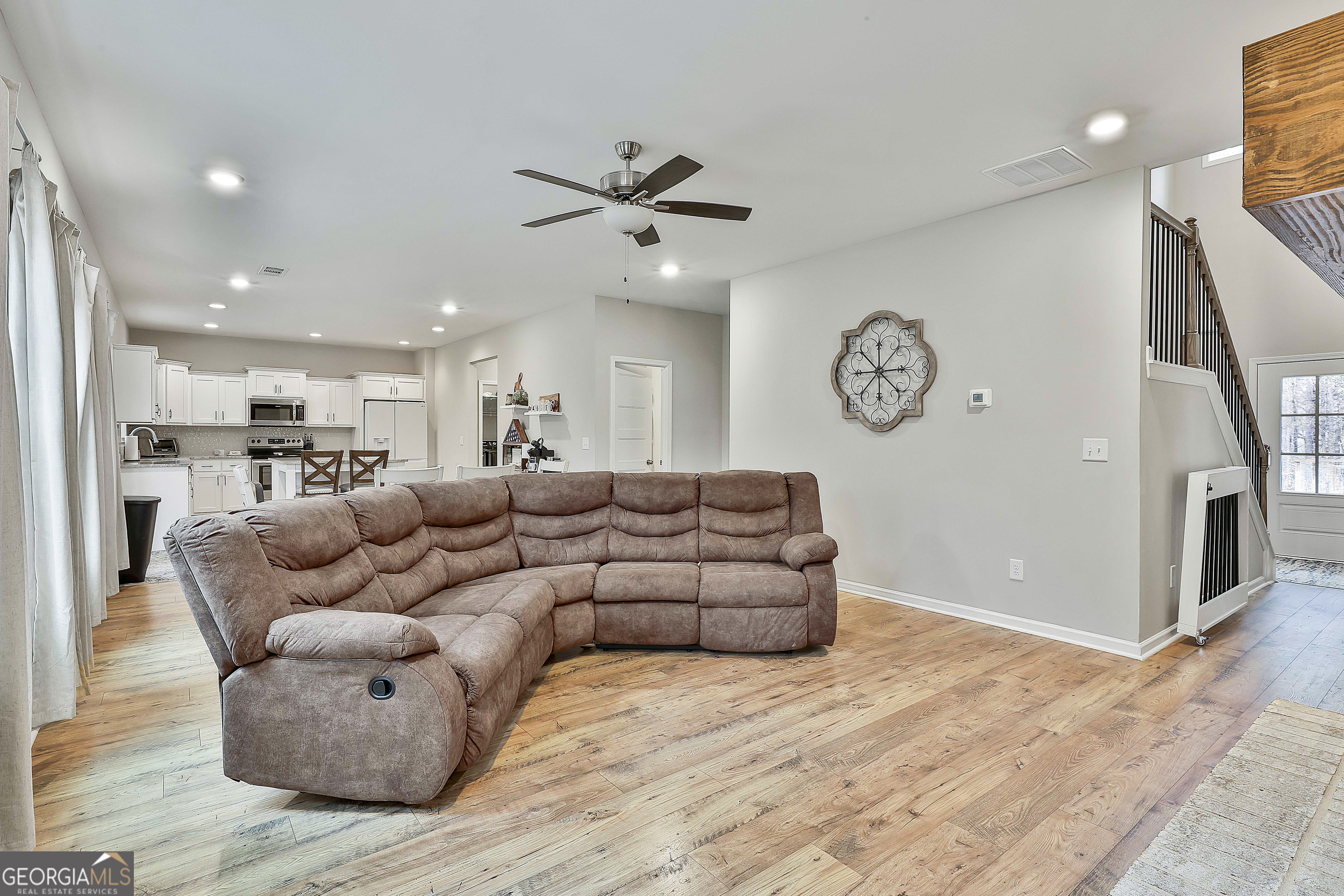 250 Mobley Bridge Road LaGrange, GA 30241 - Photo 15 of 42 a living room with furniture and a wooden floor