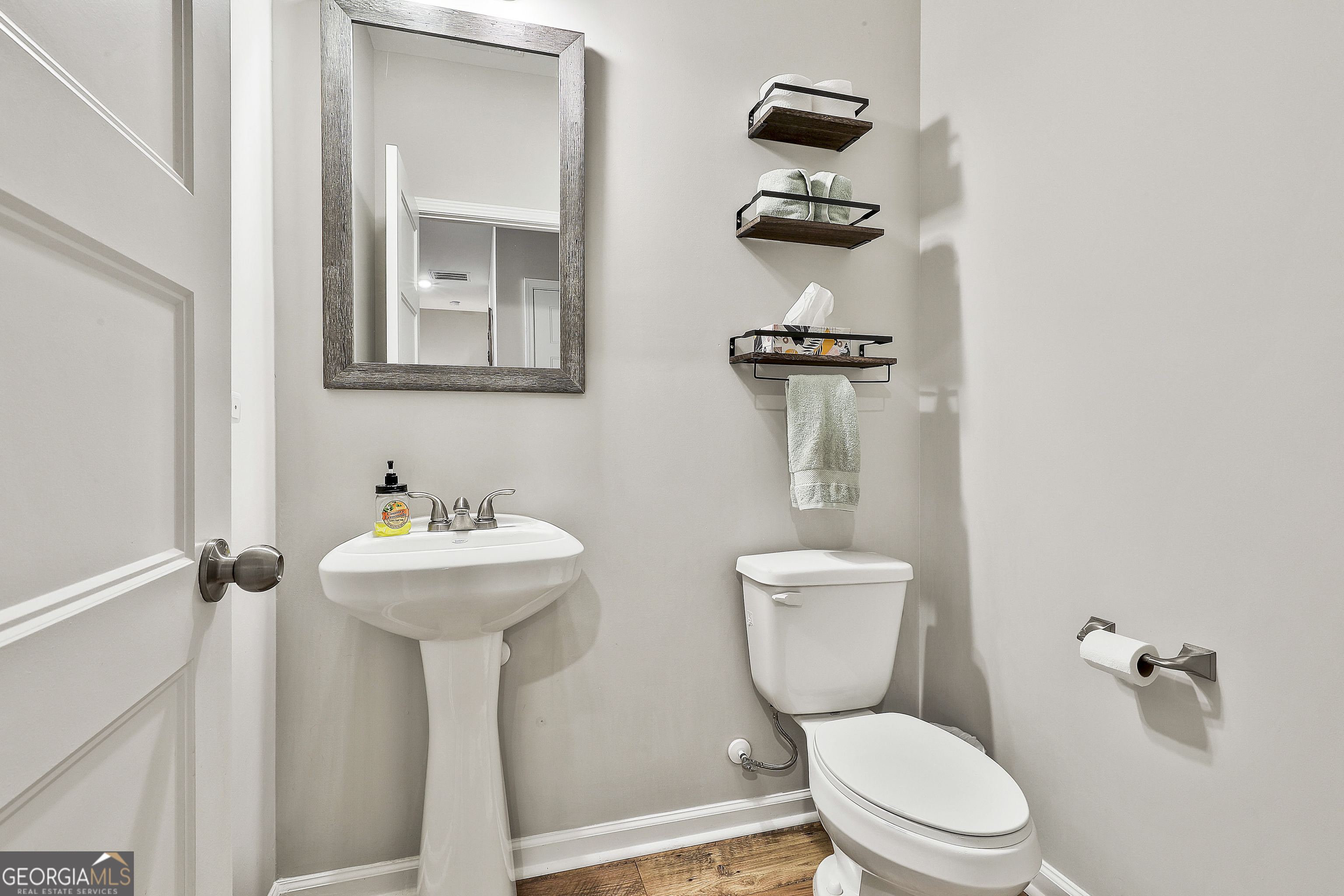 250 Mobley Bridge Road LaGrange, GA 30241 - Photo 22 of 42 a bathroom with a toilet sink and mirror