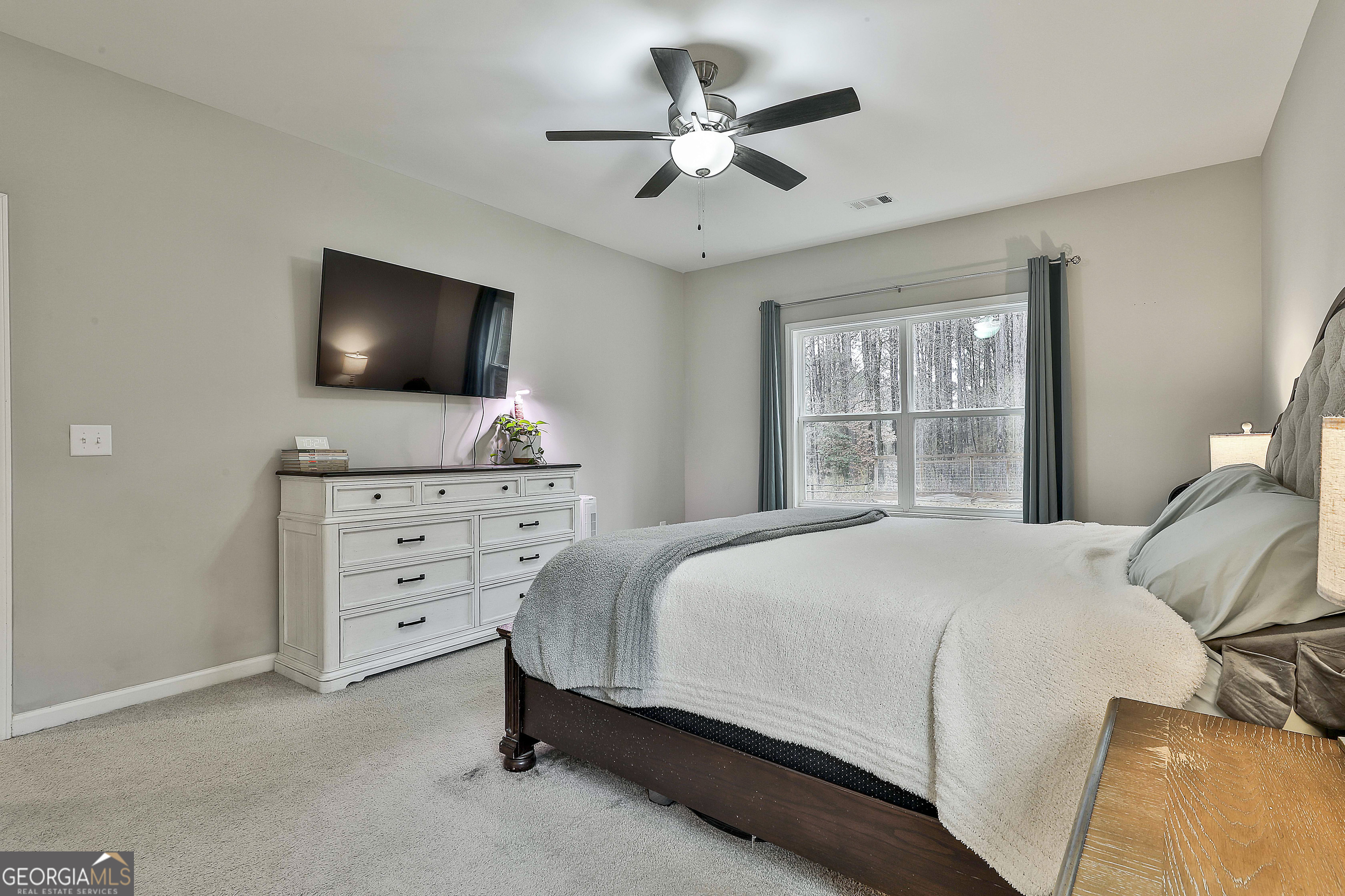 250 Mobley Bridge Road LaGrange, GA 30241 - Photo 24 of 42 a bedroom with a bed and a flat screen tv