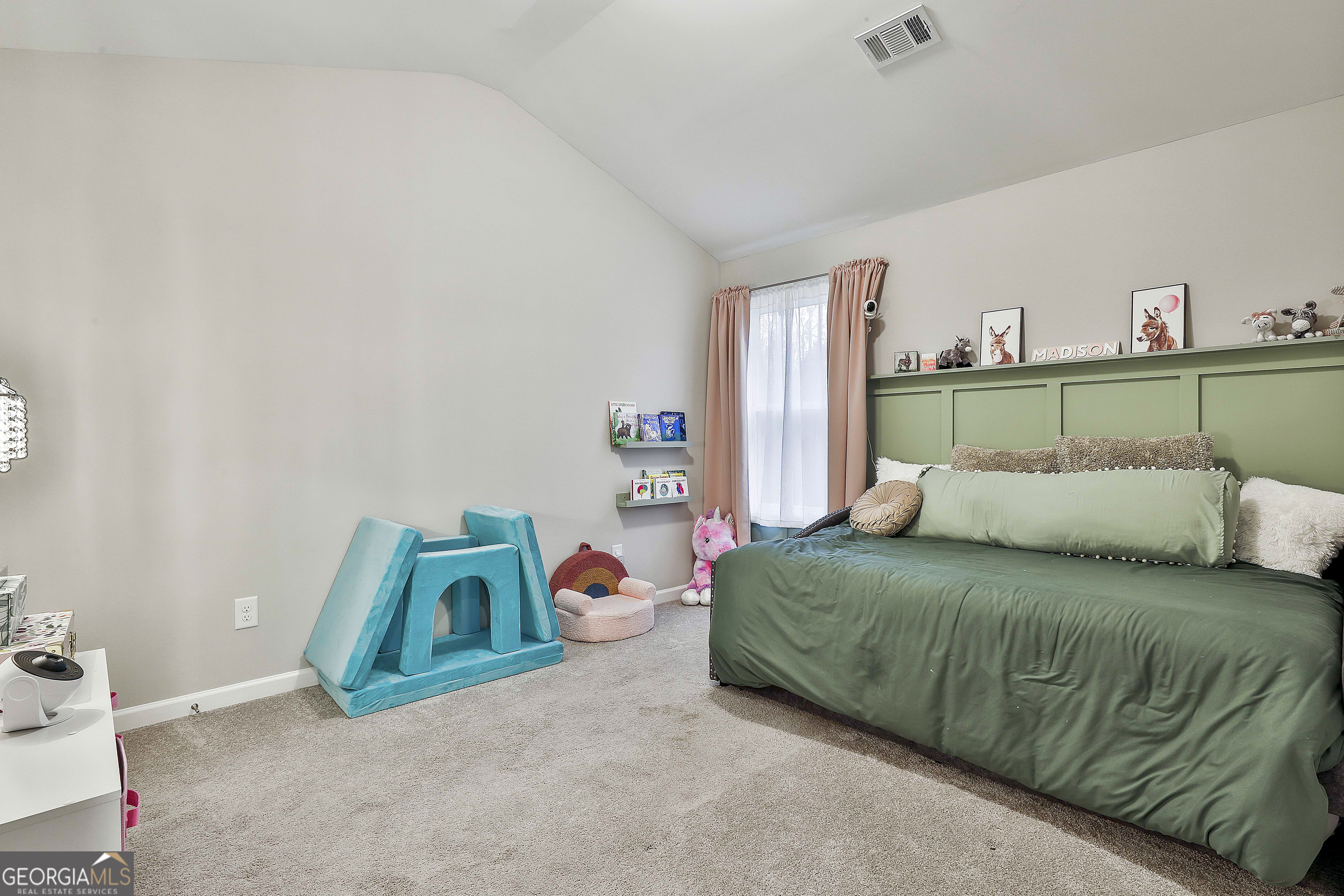 250 Mobley Bridge Road LaGrange, GA 30241 - Photo 37 of 42 a bedroom with a bed and a table