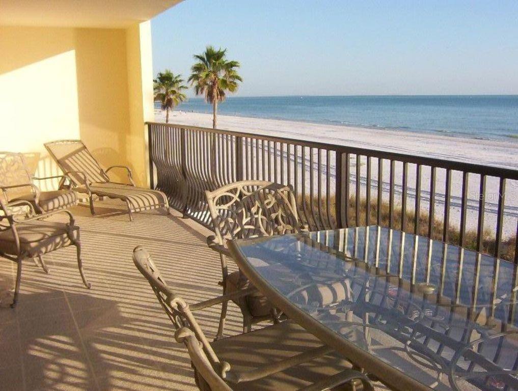 13650 Gulf Boulevard, Unit 304 Madeira Beach, FL 33708 - Photo 14 of 63 a view of a balcony with wooden floor