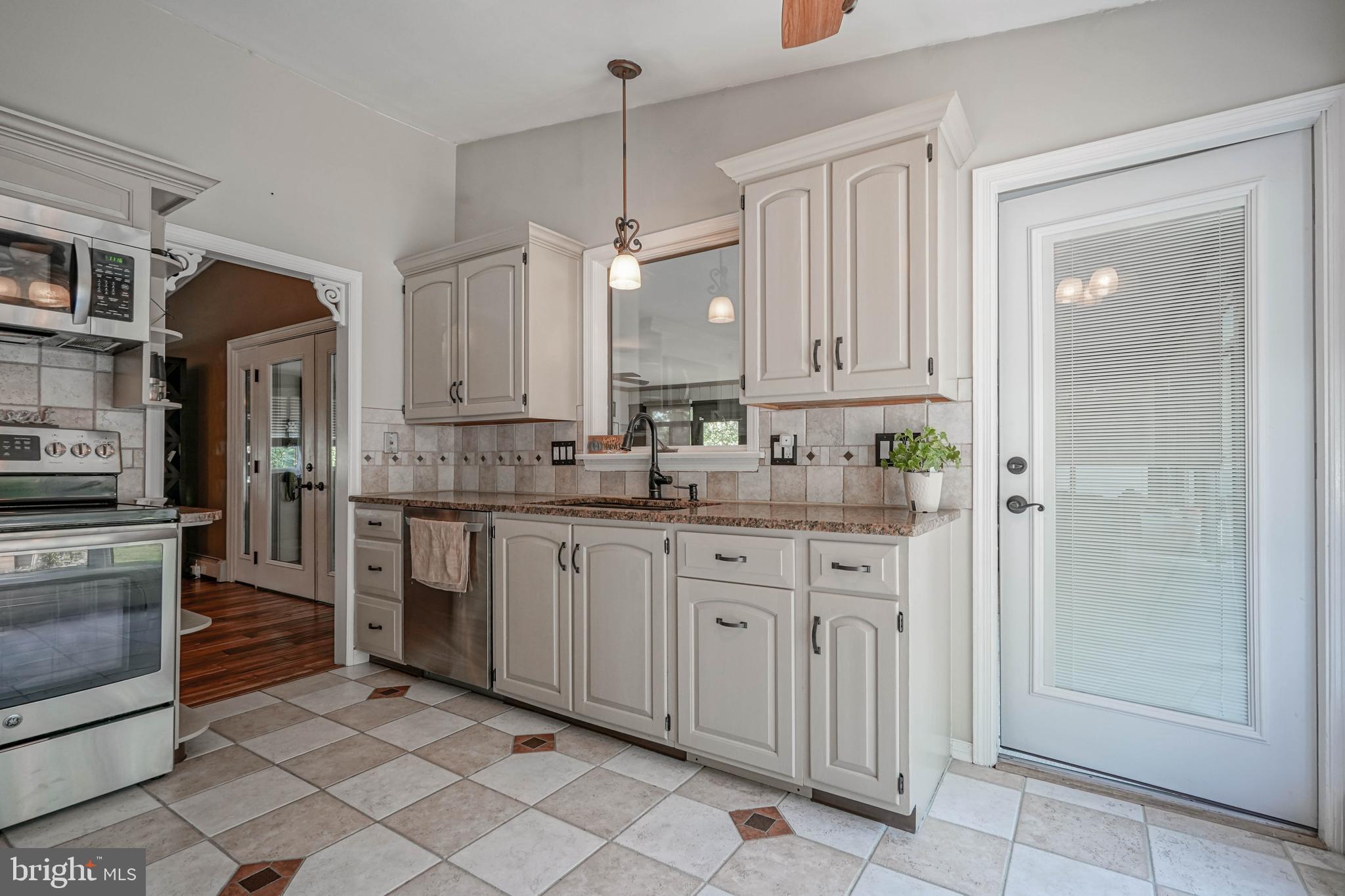 750 Moss Mill Road Hammonton, NJ 08037 - Photo 15 of 57 a kitchen with stainless steel appliances granite countertop a refrigerator and a sink