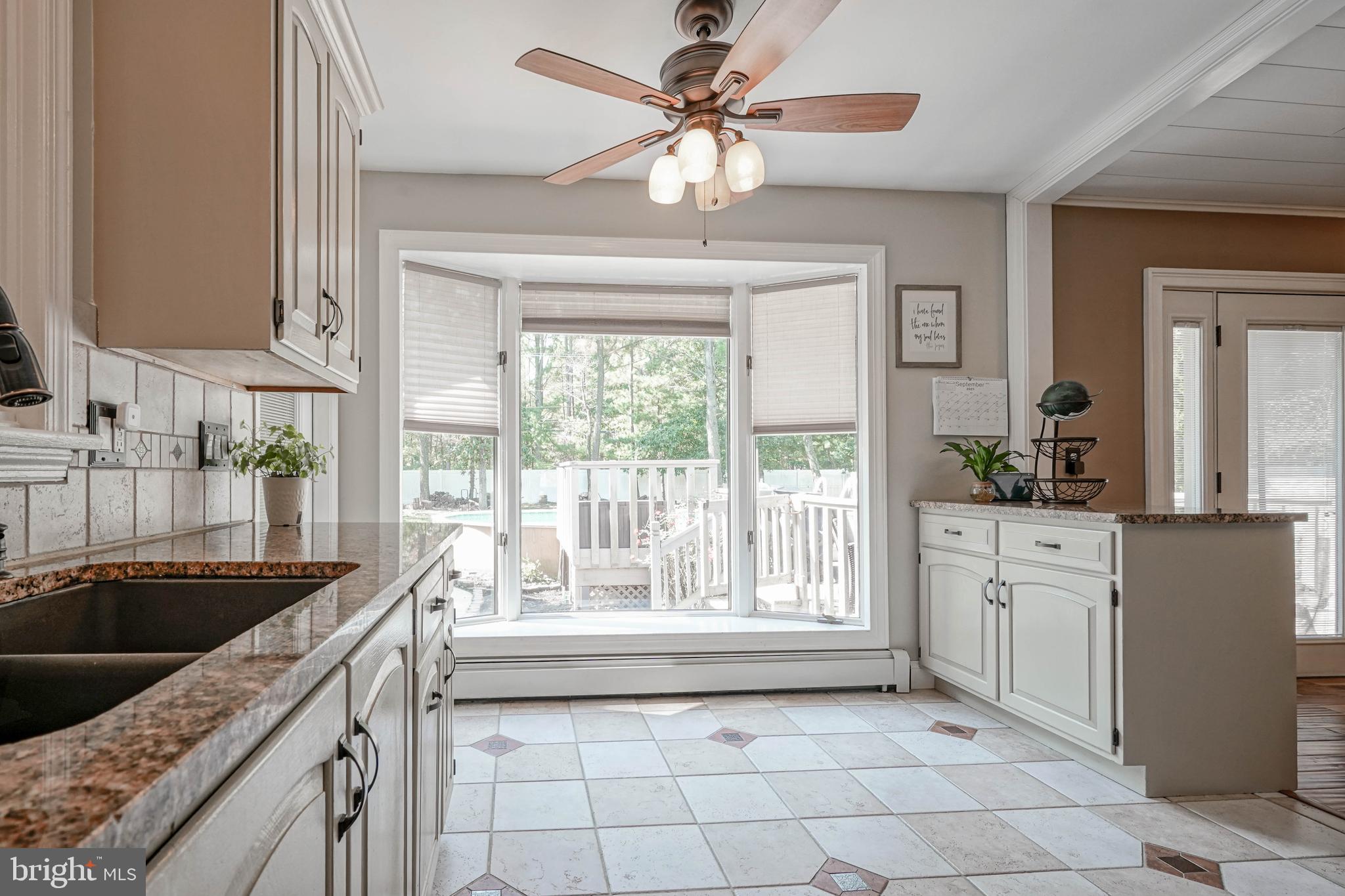 750 Moss Mill Road Hammonton, NJ 08037 - Photo 18 of 57 a kitchen with stainless steel appliances granite countertop a sink a counter space and a window