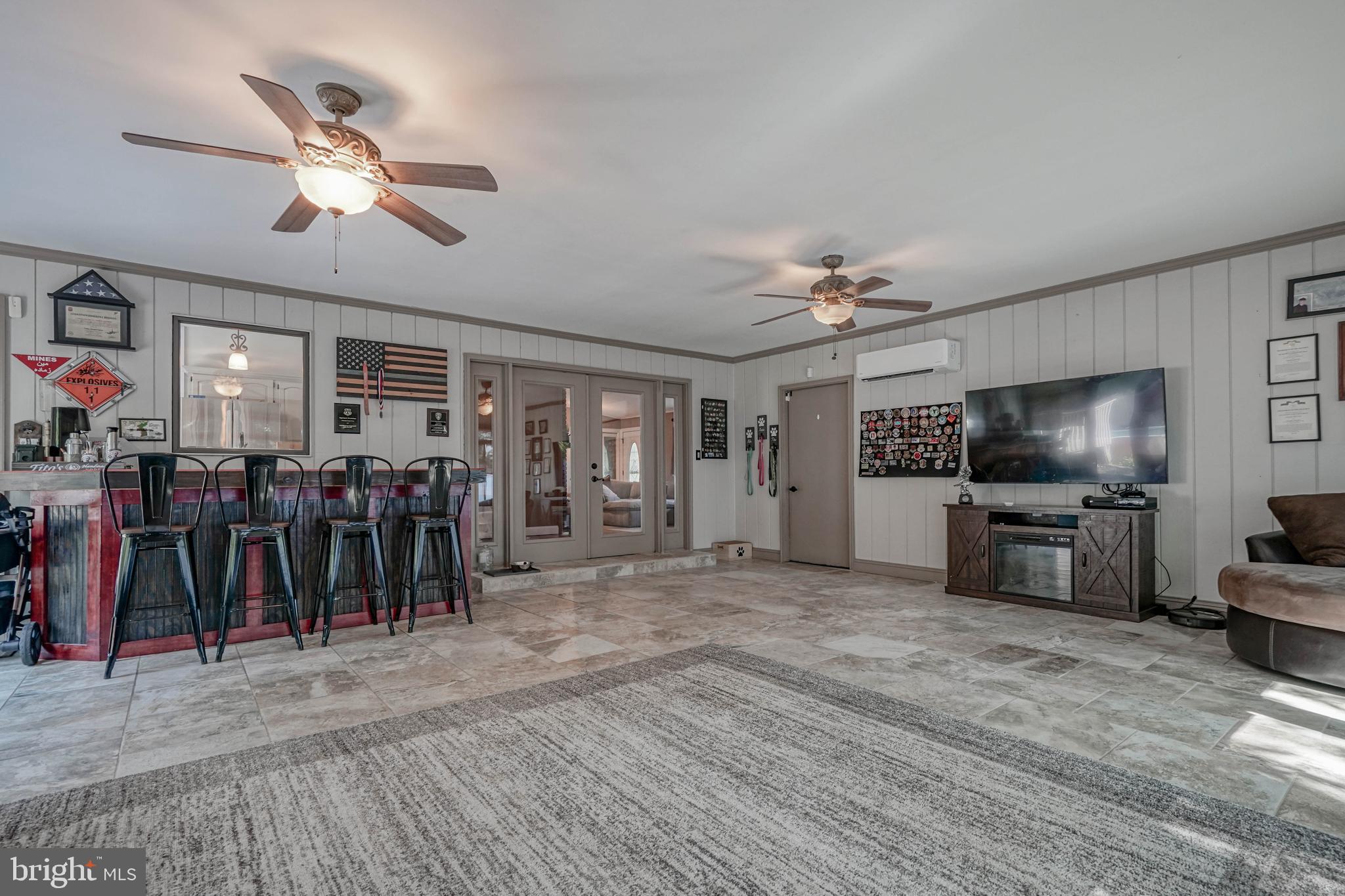 750 Moss Mill Road Hammonton, NJ 08037 - Photo 22 of 57 a living room with furniture and a flat screen tv