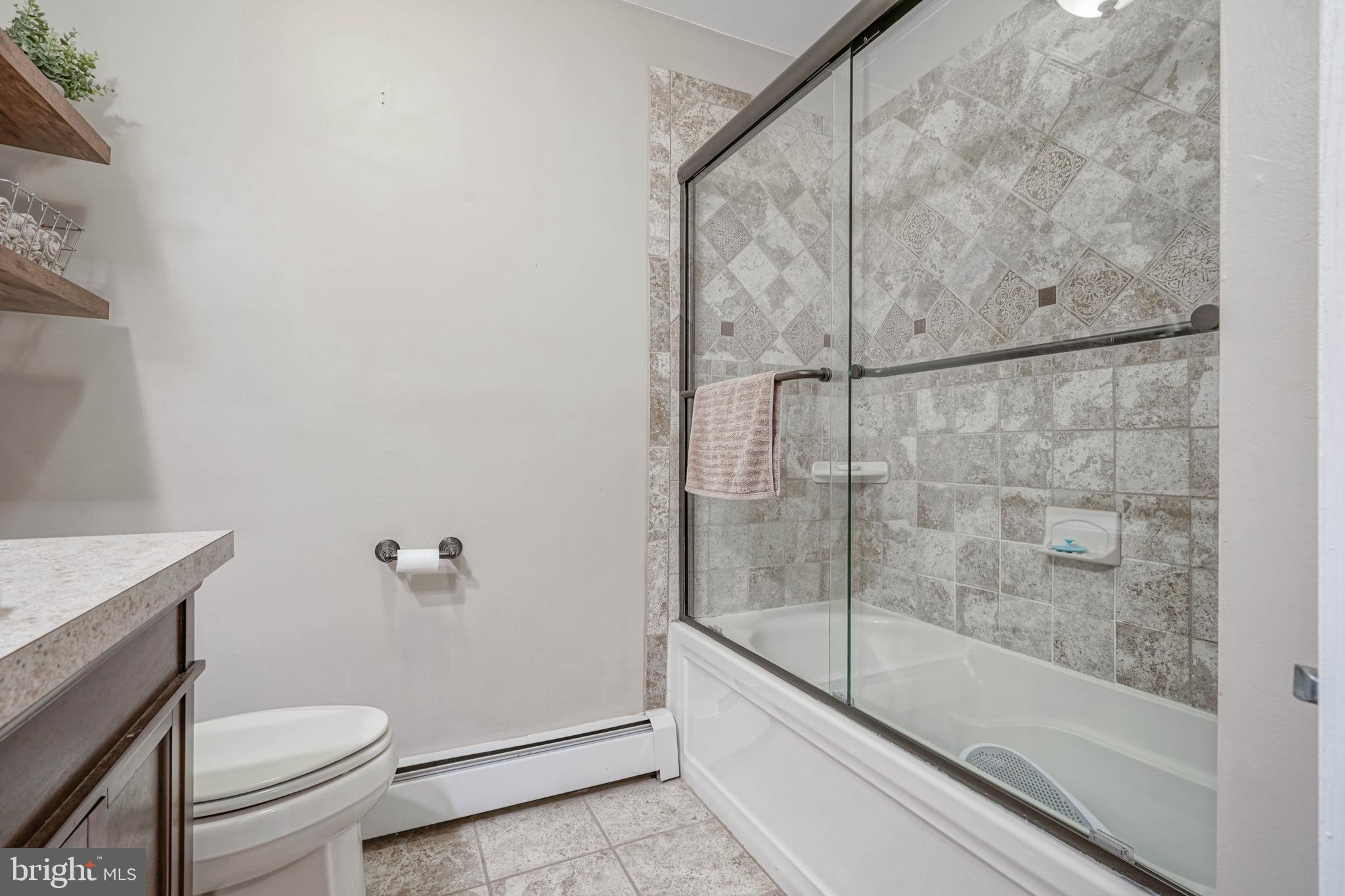 750 Moss Mill Road Hammonton, NJ 08037 - Photo 27 of 57 a bathroom with a granite countertop bathtub shower and toilet