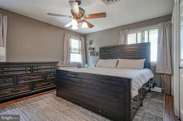 a bedroom with a bed and a fireplace