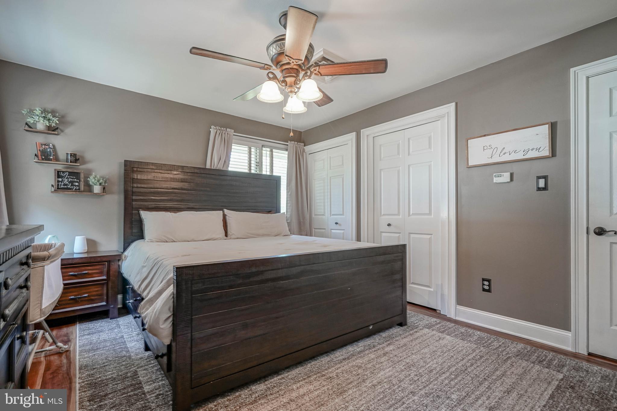 750 Moss Mill Road Hammonton, NJ 08037 - Photo 30 of 57 a bedroom with a bed and a chandelier