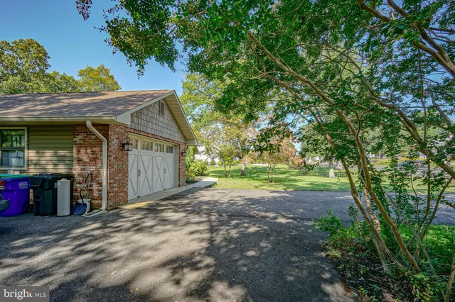 a view of a house with a tree