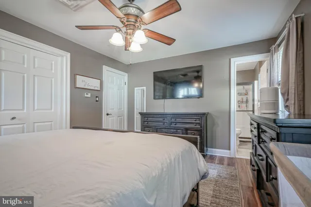 a bathroom with a toilet a sink and a window