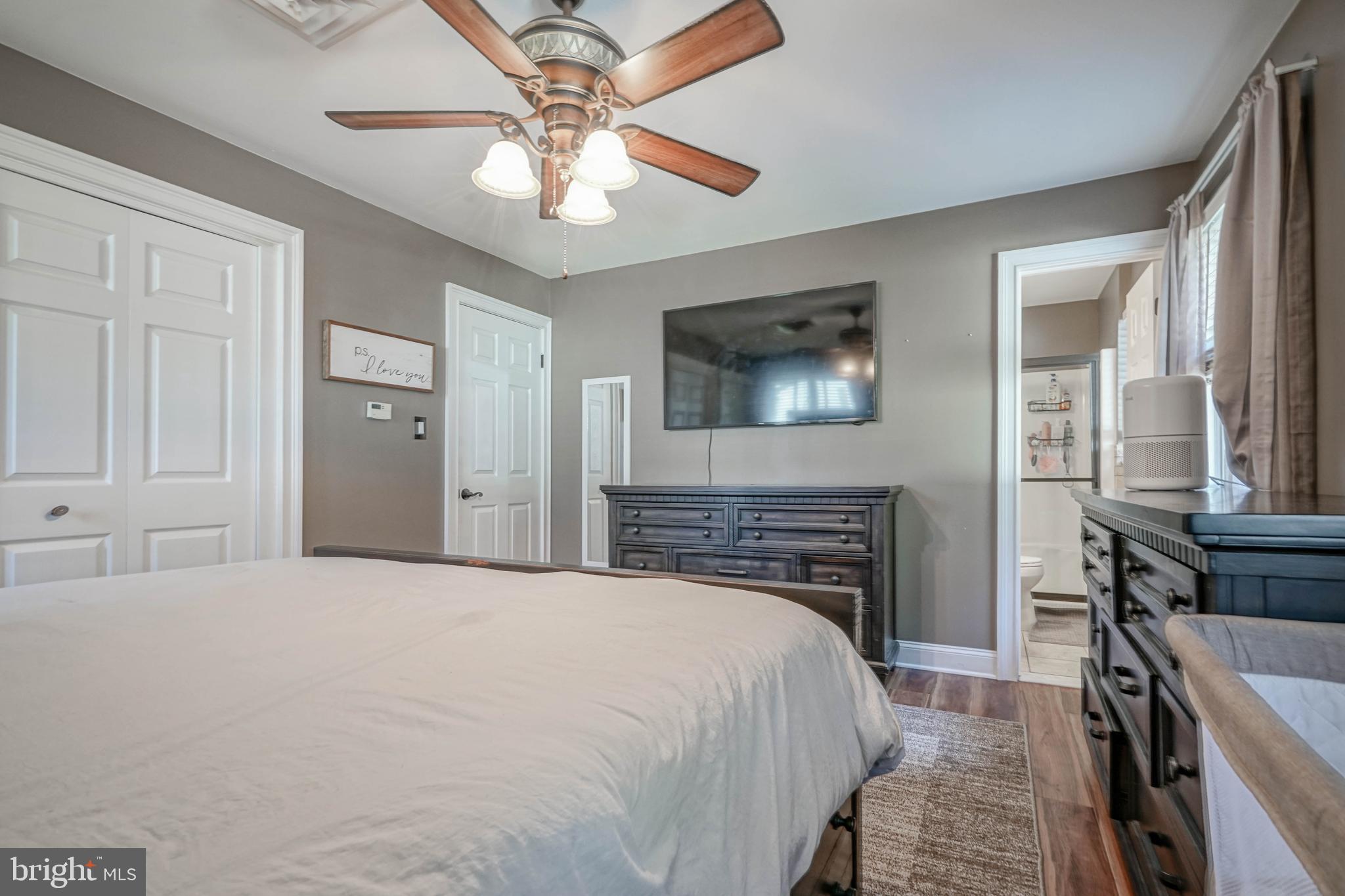 750 Moss Mill Road Hammonton, NJ 08037 - Photo 31 of 57 a bedroom with a bed and a fireplace