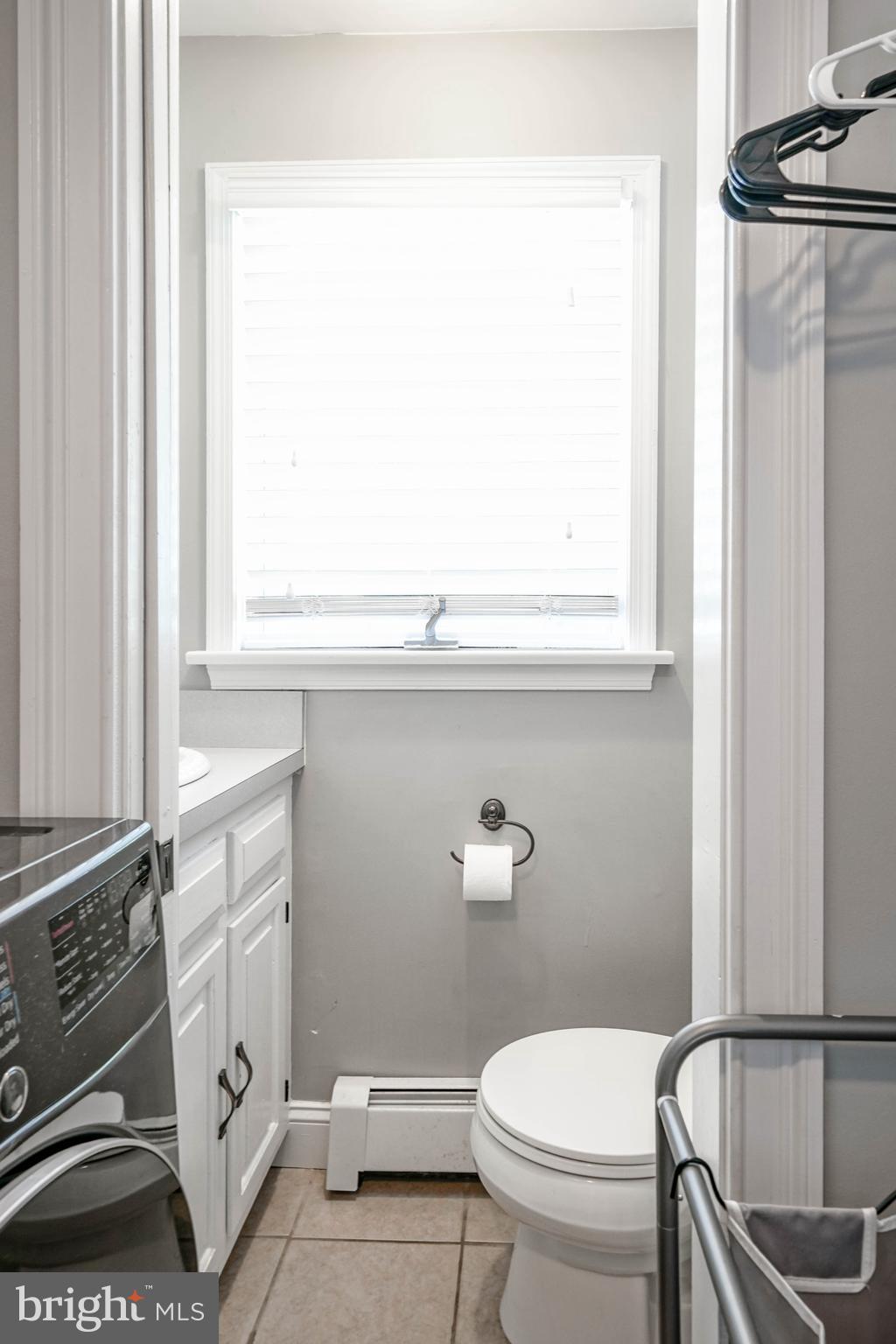 750 Moss Mill Road Hammonton, NJ 08037 - Photo 34 of 57 a bathroom with a toilet a sink and a window