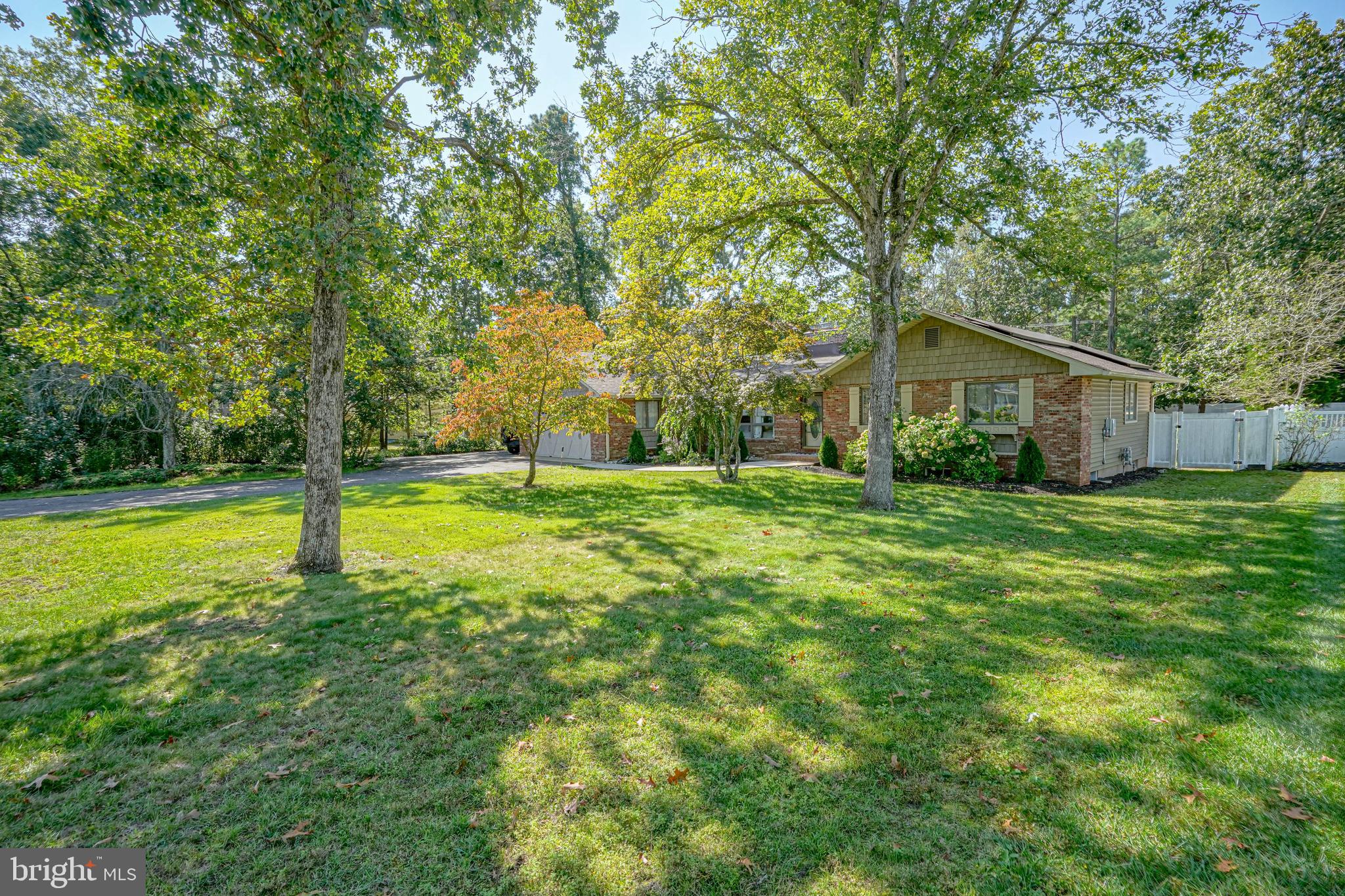 750 Moss Mill Road Hammonton, NJ 08037 - Photo 4 of 57 a view of a house with a big yard and large trees