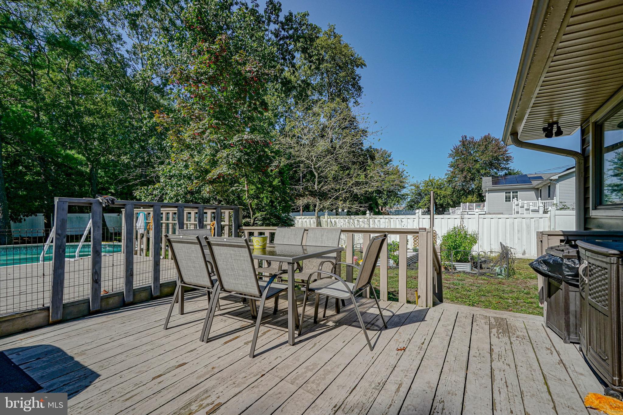 750 Moss Mill Road Hammonton, NJ 08037 - Photo 42 of 57 a view of deck with table and chairs a barbeque with wooden floor and fence