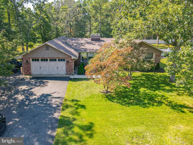 an aerial view of residential house with outdoor space and swimming pool