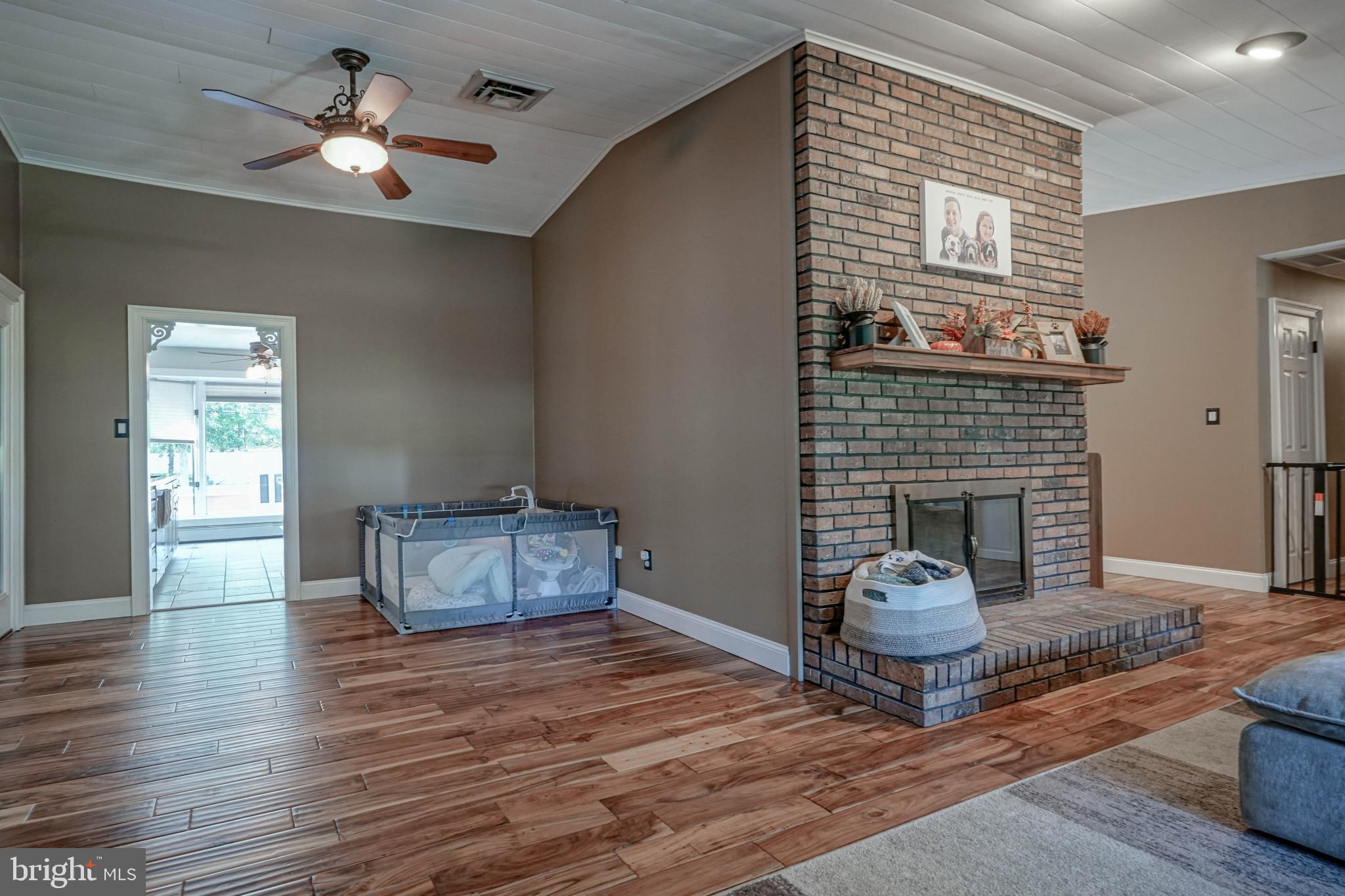 750 Moss Mill Road Hammonton, NJ 08037 - Photo 10 of 57 a living room with furniture and a fireplace