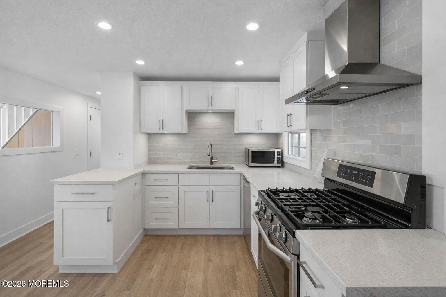 517 Middle Lane Howell, NJ 07731 - Photo 24 of 31 a kitchen with cabinets and stainless steel appliances