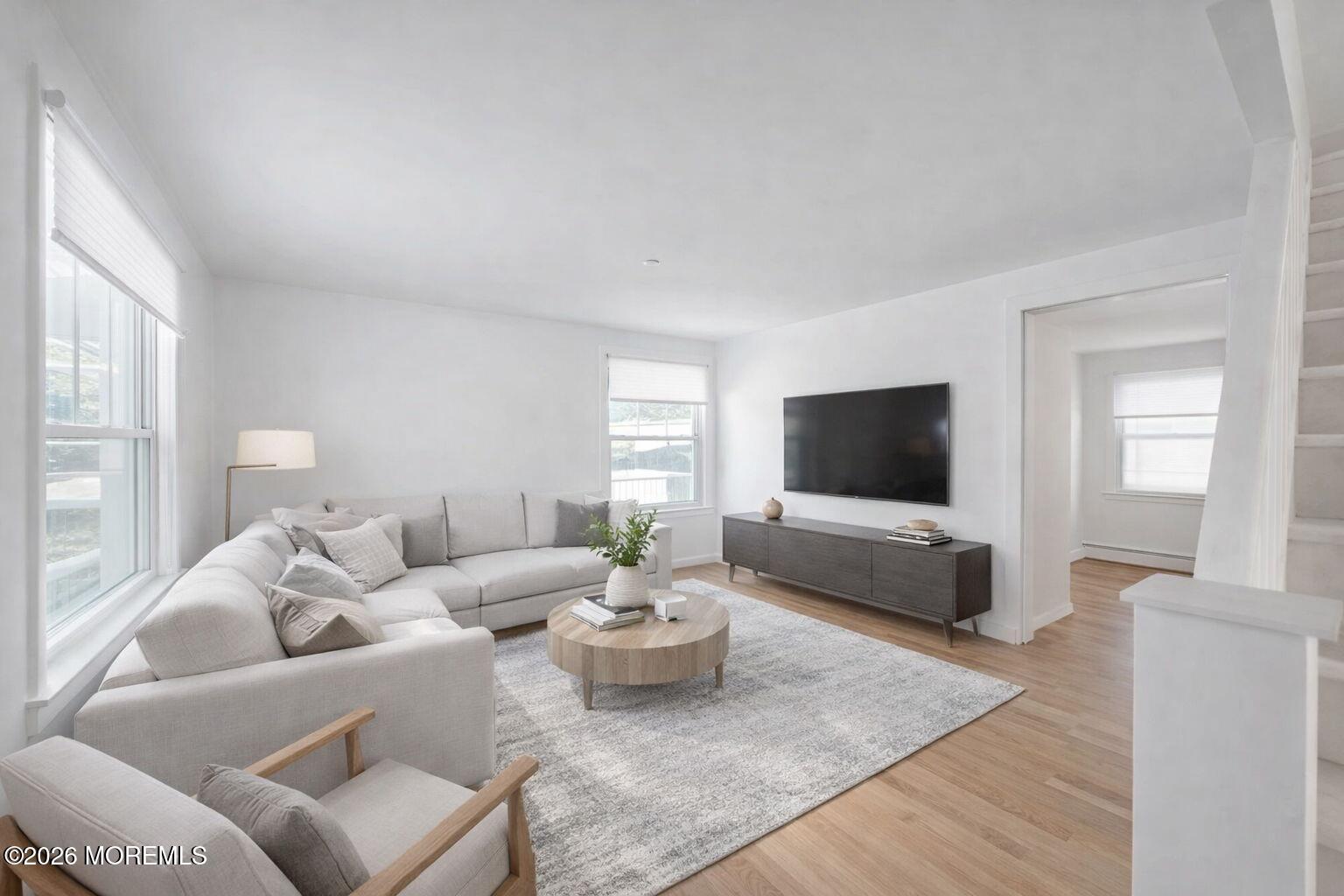 517 Middle Lane Howell, NJ 07731 - Photo 25 of 31 a living room with furniture and a flat screen tv