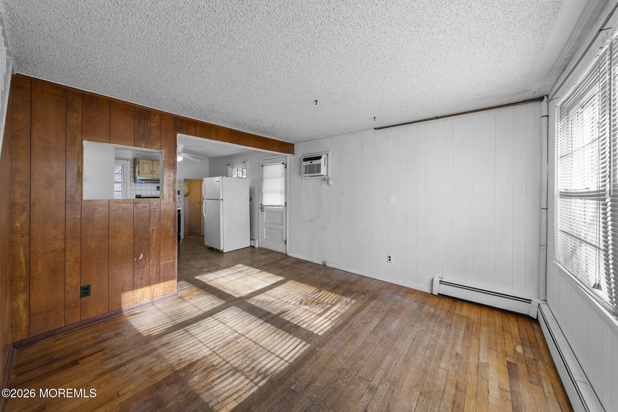 517 Middle Lane Howell, NJ 07731 - Photo 5 of 31 a view of empty room with wooden floor and fan