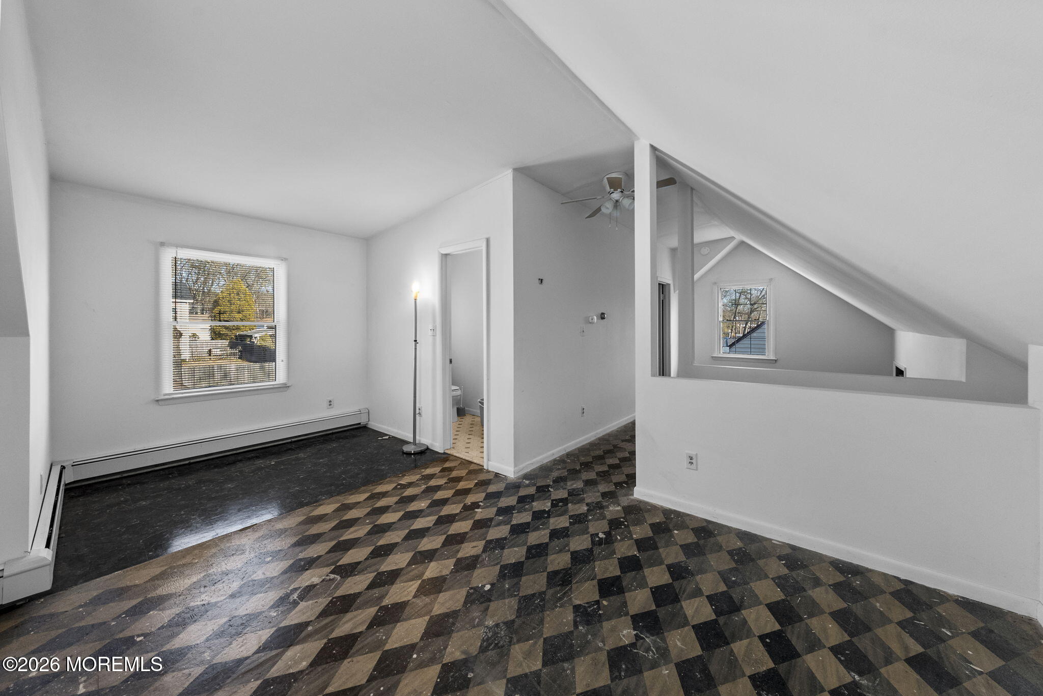 517 Middle Lane Howell, NJ 07731 - Photo 7 of 31 a view of a bedroom with wooden floor and windows