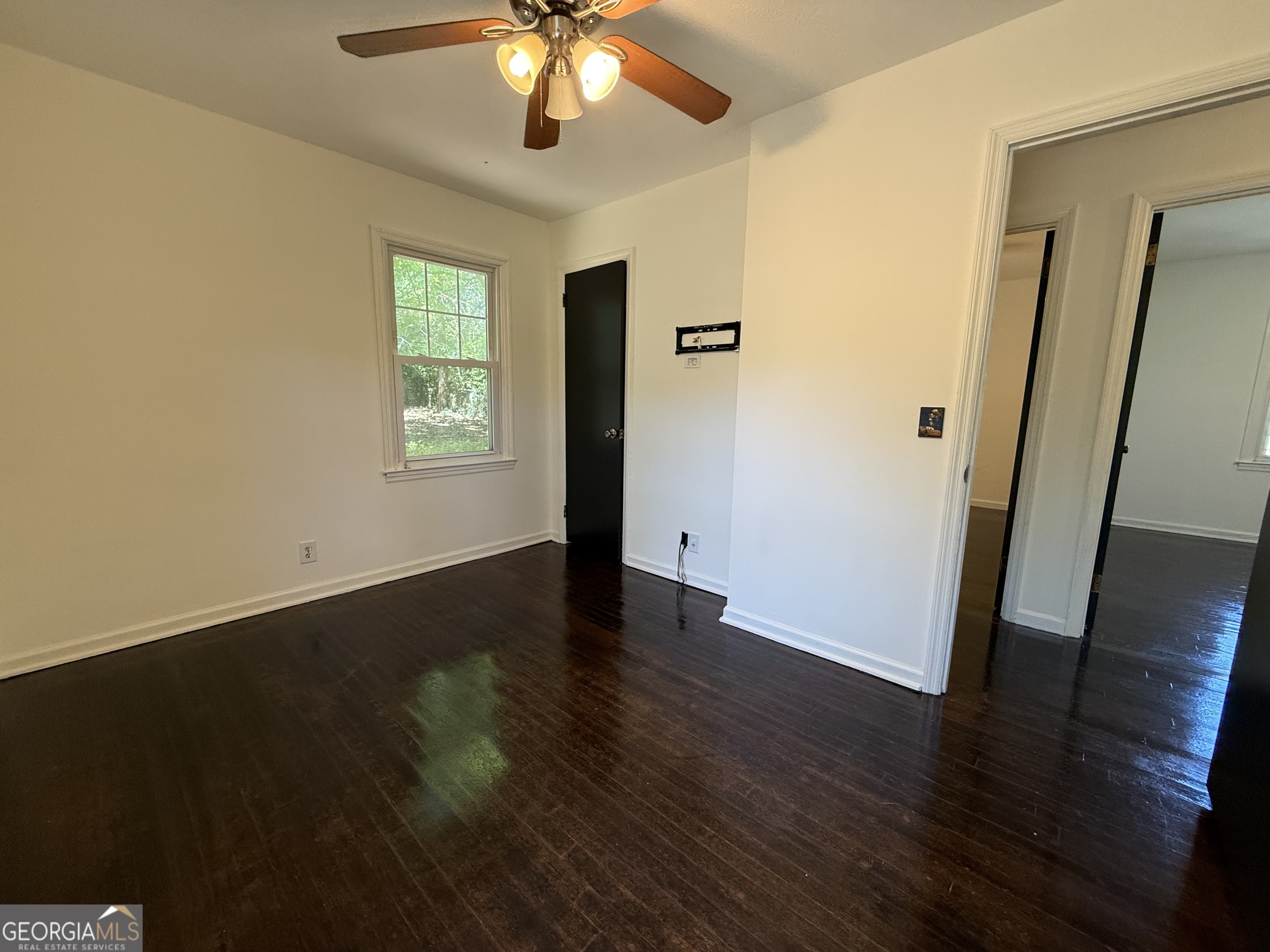 179 Youngs Mill Road LaGrange, GA 30241 - Photo 17 of 30 a view of an empty room with wooden floor and a window