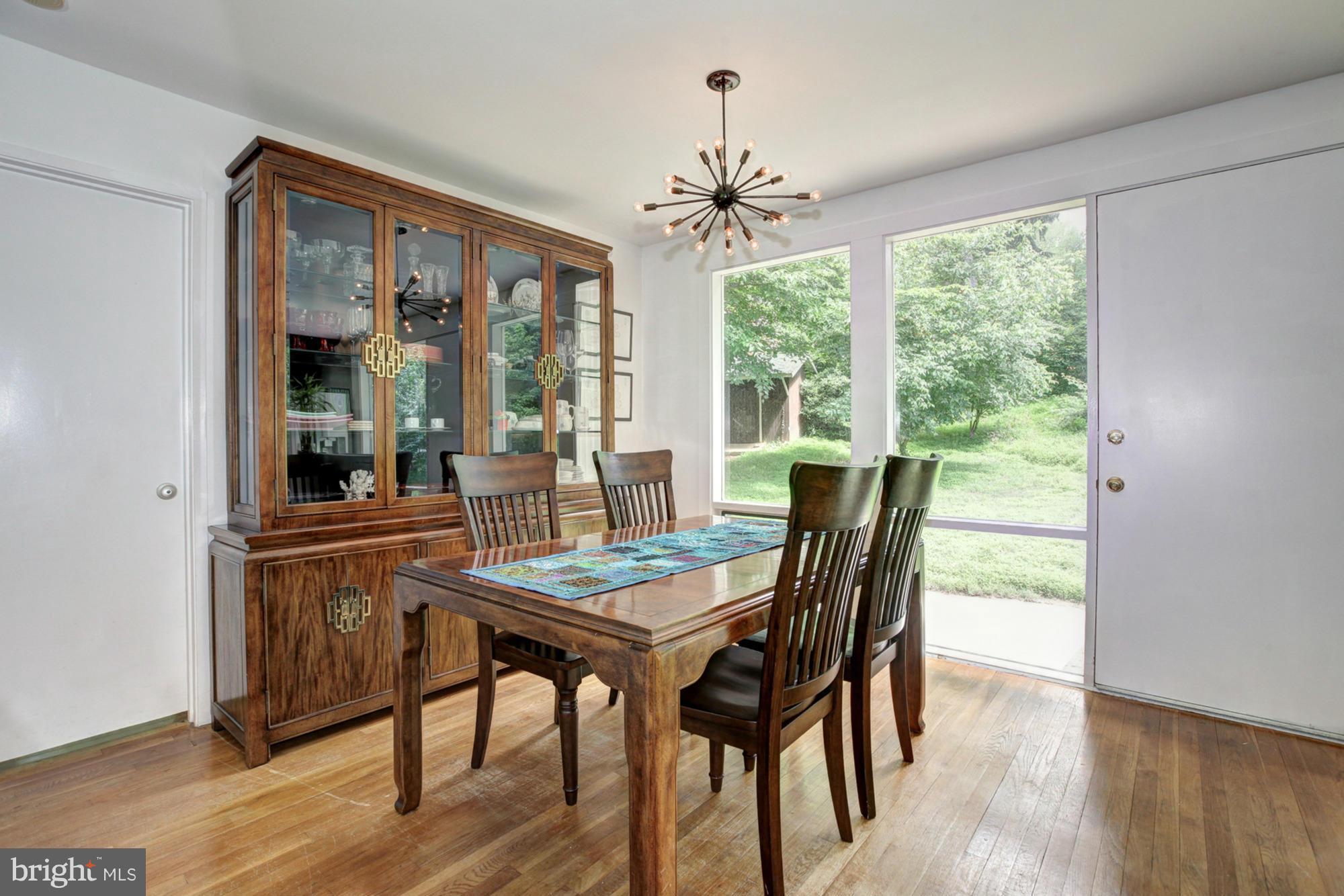 3946 Rickover Road Silver Spring, MD 20902 - Photo 11 of 30 a dining room with furniture window wooden floor