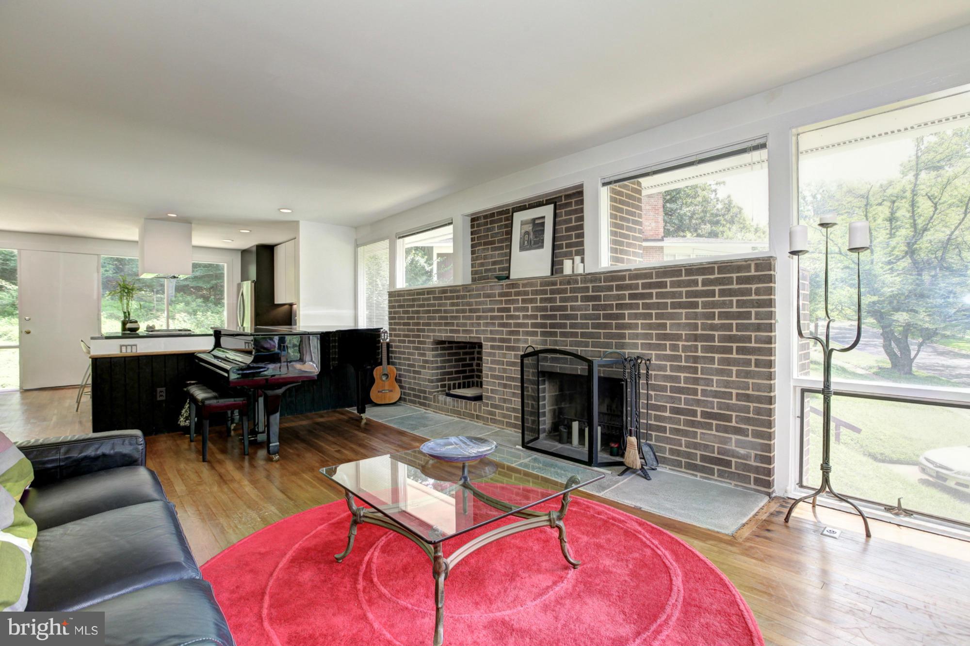 3946 Rickover Road Silver Spring, MD 20902 - Photo 12 of 30 a living room with furniture and a fireplace