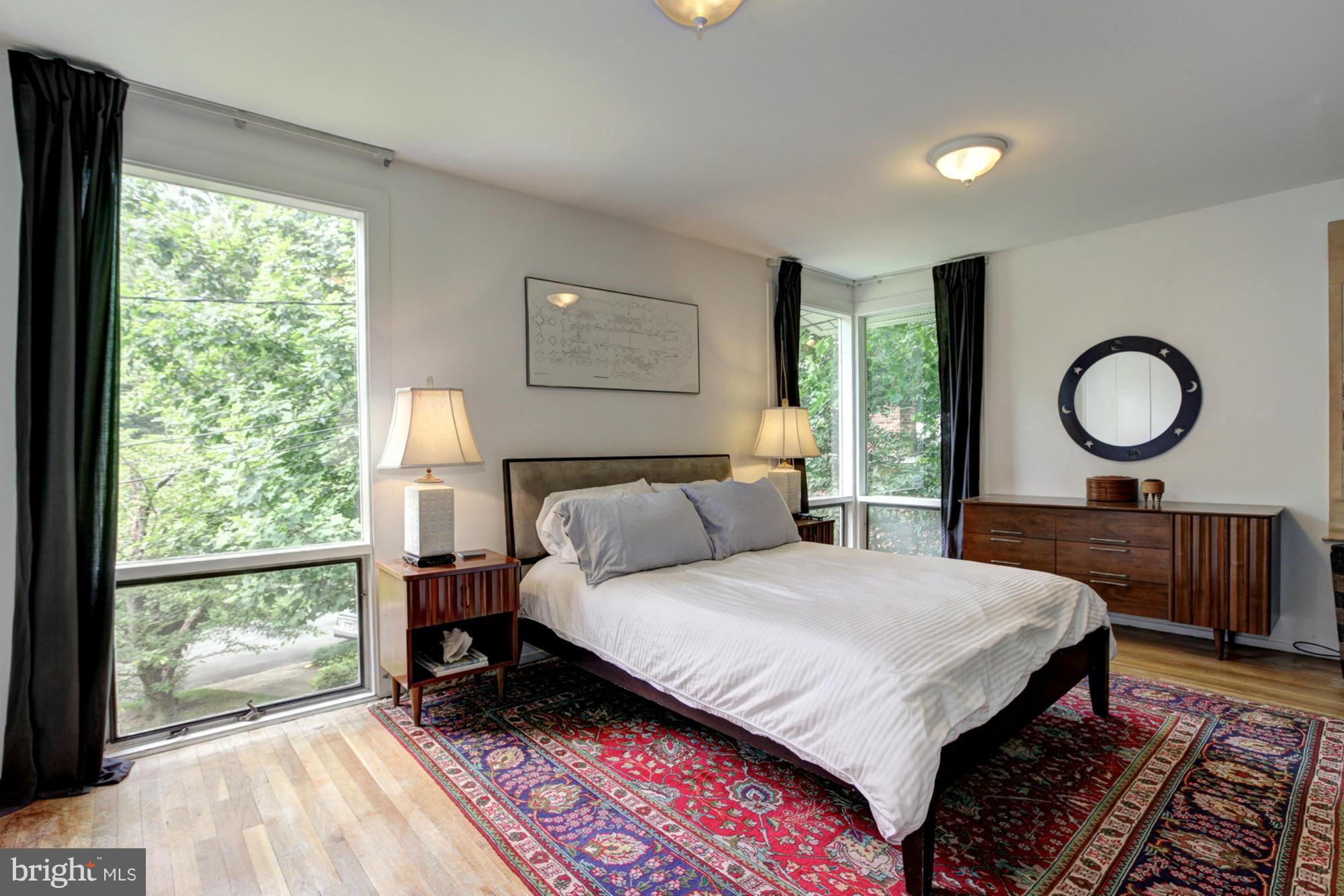 3946 Rickover Road Silver Spring, MD 20902 - Photo 15 of 30 a bedroom with a large bed and a large window