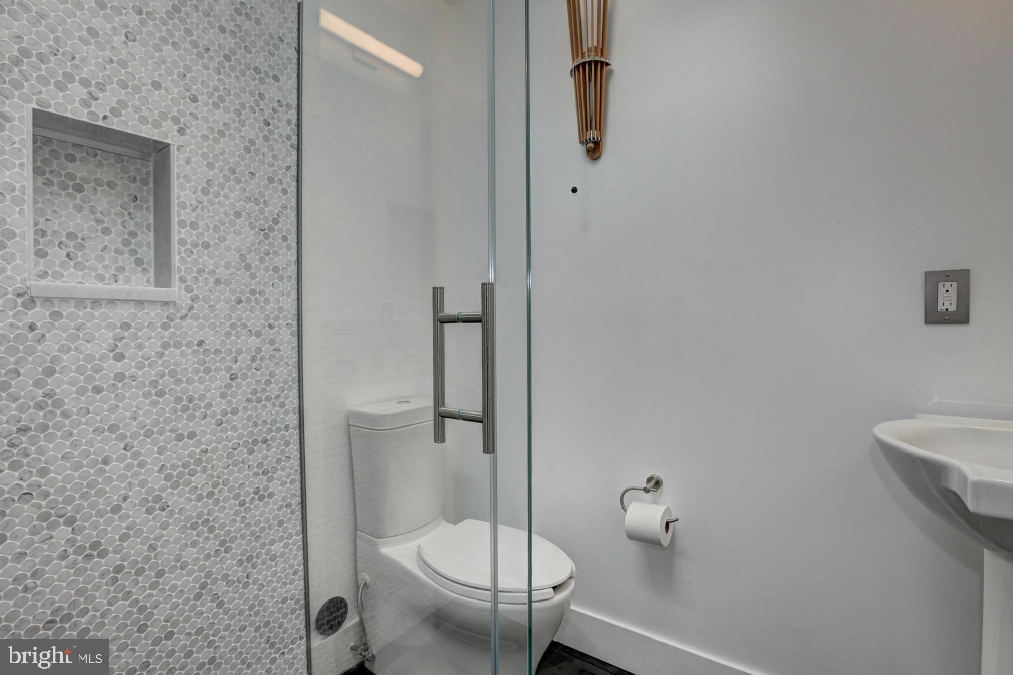 3946 Rickover Road Silver Spring, MD 20902 - Photo 16 of 30 a bathroom with a toilet and a shower