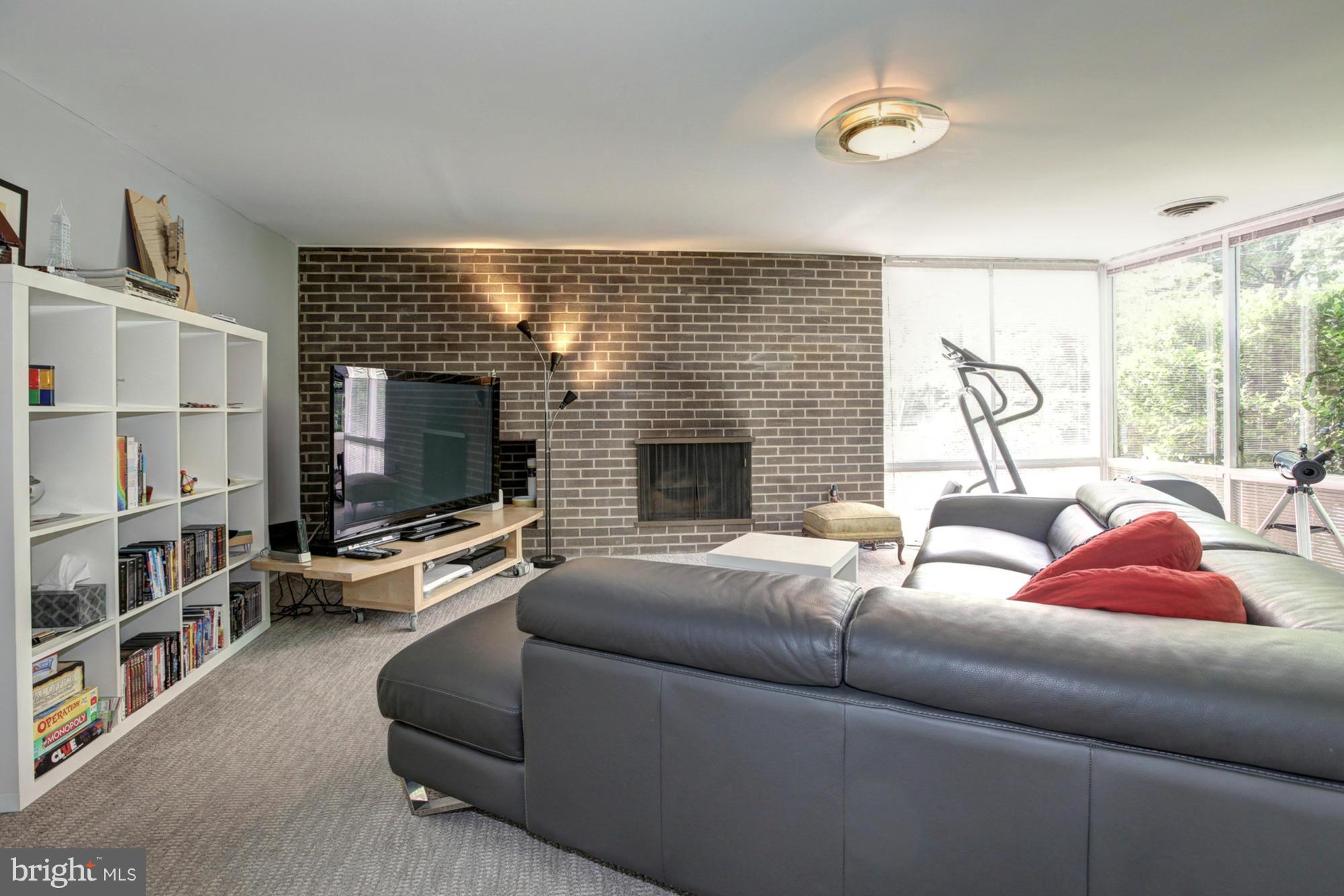 3946 Rickover Road Silver Spring, MD 20902 - Photo 23 of 30 a living room with furniture and a flat screen tv